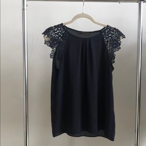 Short sleeved blouse with flower detailed sleeves